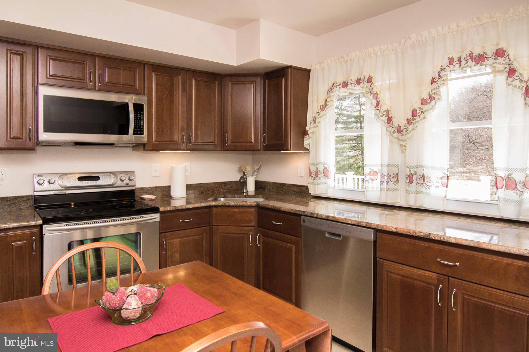 1104 Sturbridge Road Fallston, MD 21047 - Photo 5 of 28 a kitchen with a sink stove top oven and microwave