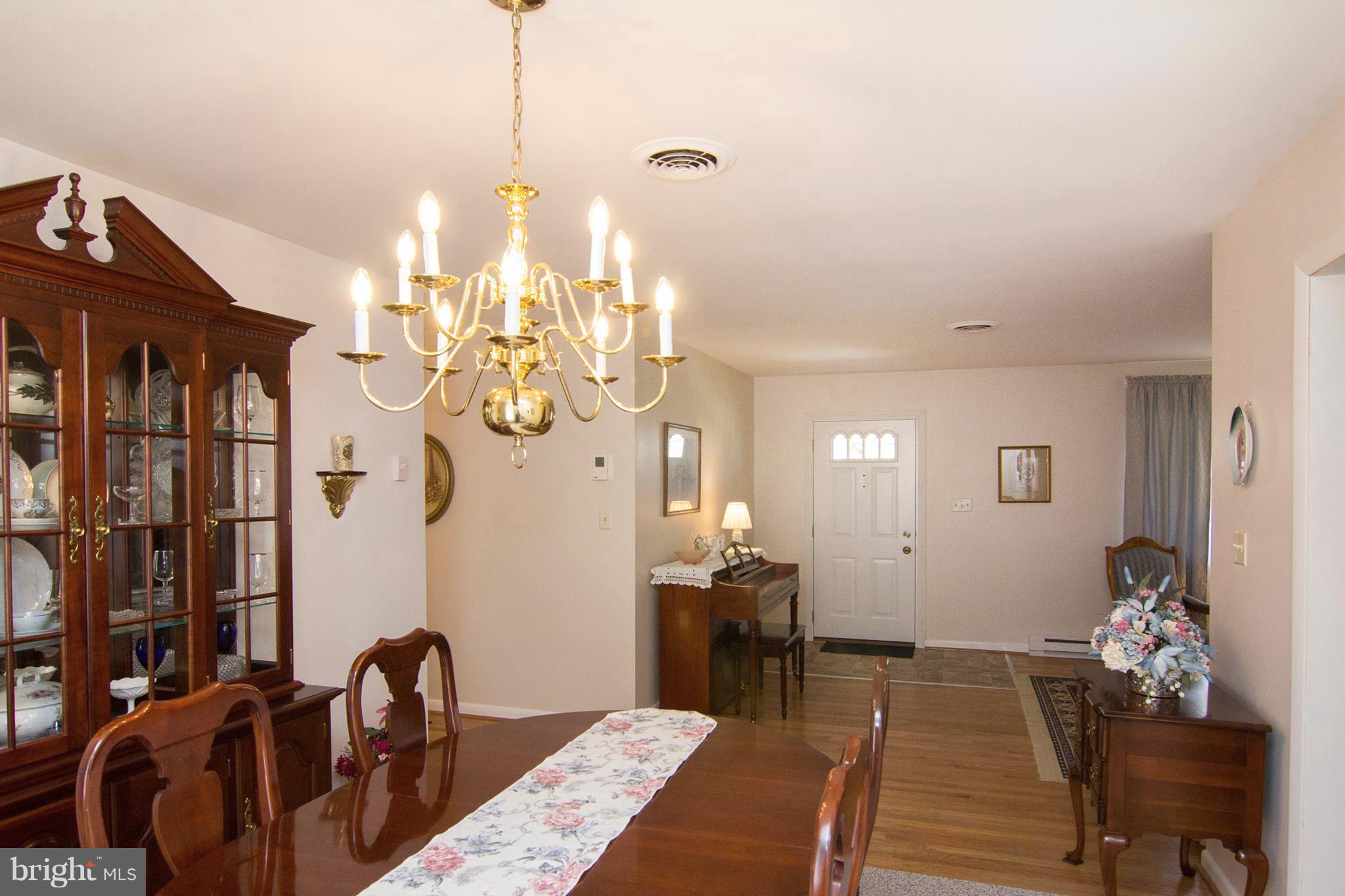 1104 Sturbridge Road Fallston, MD 21047 - Photo 8 of 28 a view of a dining room with furniture and wooden floor