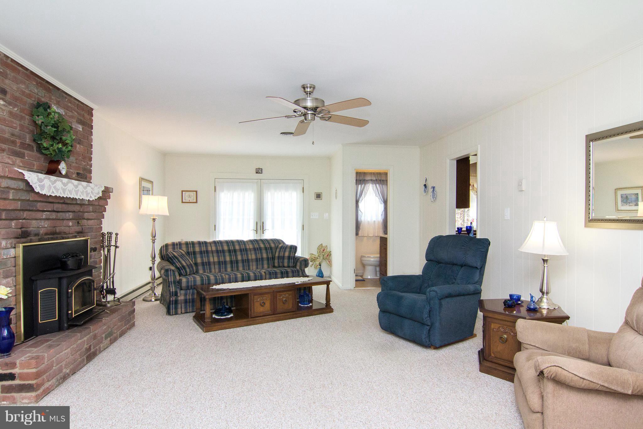 1104 Sturbridge Road Fallston, MD 21047 - Photo 10 of 28 a living room with furniture and a fireplace