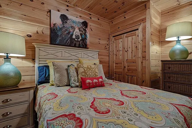 a bedroom with a bed and dresser