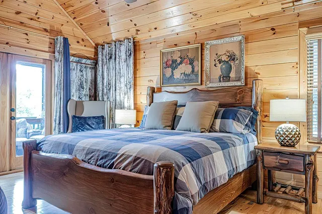 a bathroom with a granite countertop sink and a window