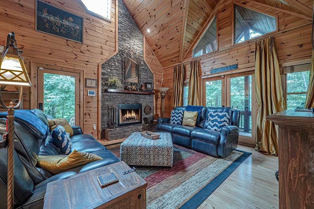 35 Leatherwood Mountain Road Cherry Log, GA 30522 - Photo 2 of 58 a living room with furniture and a fireplace