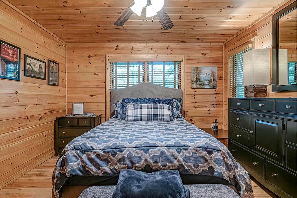 35 Leatherwood Mountain Road Cherry Log, GA 30522 - Photo 30 of 58 a bedroom with a bed and a dresser