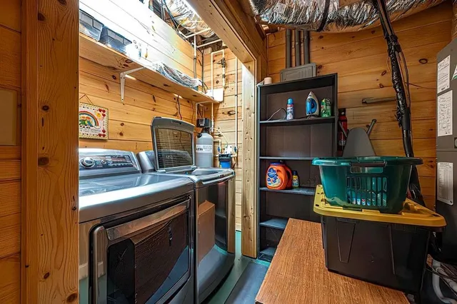 a view of a chair and table in the backyard