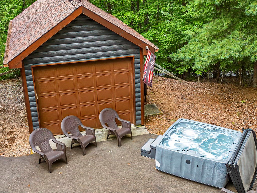 35 Leatherwood Mountain Road Cherry Log, GA 30522 - Photo 33 of 58 a backyard of a house with seating space