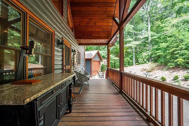 a view of a room with wooden floor and wooden fence