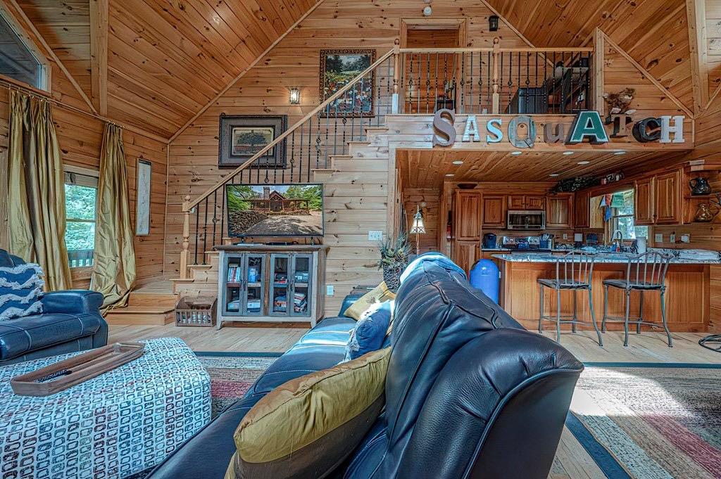 35 Leatherwood Mountain Road Cherry Log, GA 30522 - Photo 4 of 58 a living room with furniture a fireplace and a table