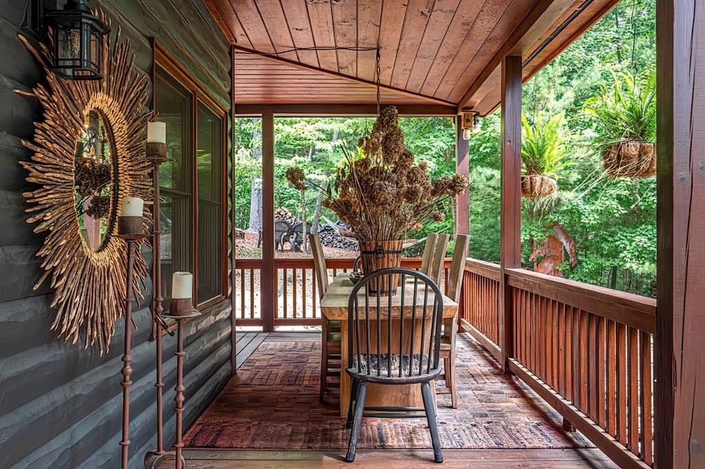 35 Leatherwood Mountain Road Cherry Log, GA 30522 - Photo 42 of 58 a view of a chairs and table in the balcony