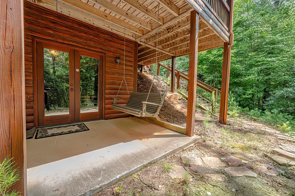 35 Leatherwood Mountain Road Cherry Log, GA 30522 - Photo 43 of 58 a view of a room with wooden floor and wooden fence