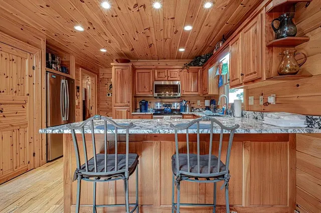 a open kitchen with a table and chairs