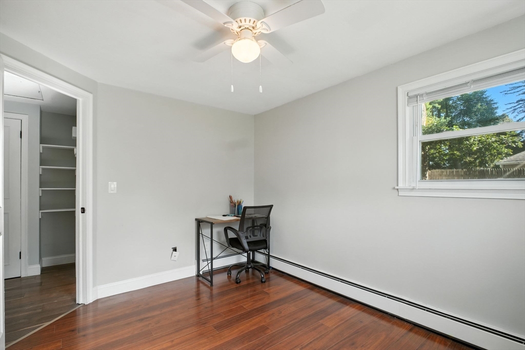 19 Harbour Road Springfield, MA 01118 - Photo 22 of 28 a view of a workspace with wooden floor and a window