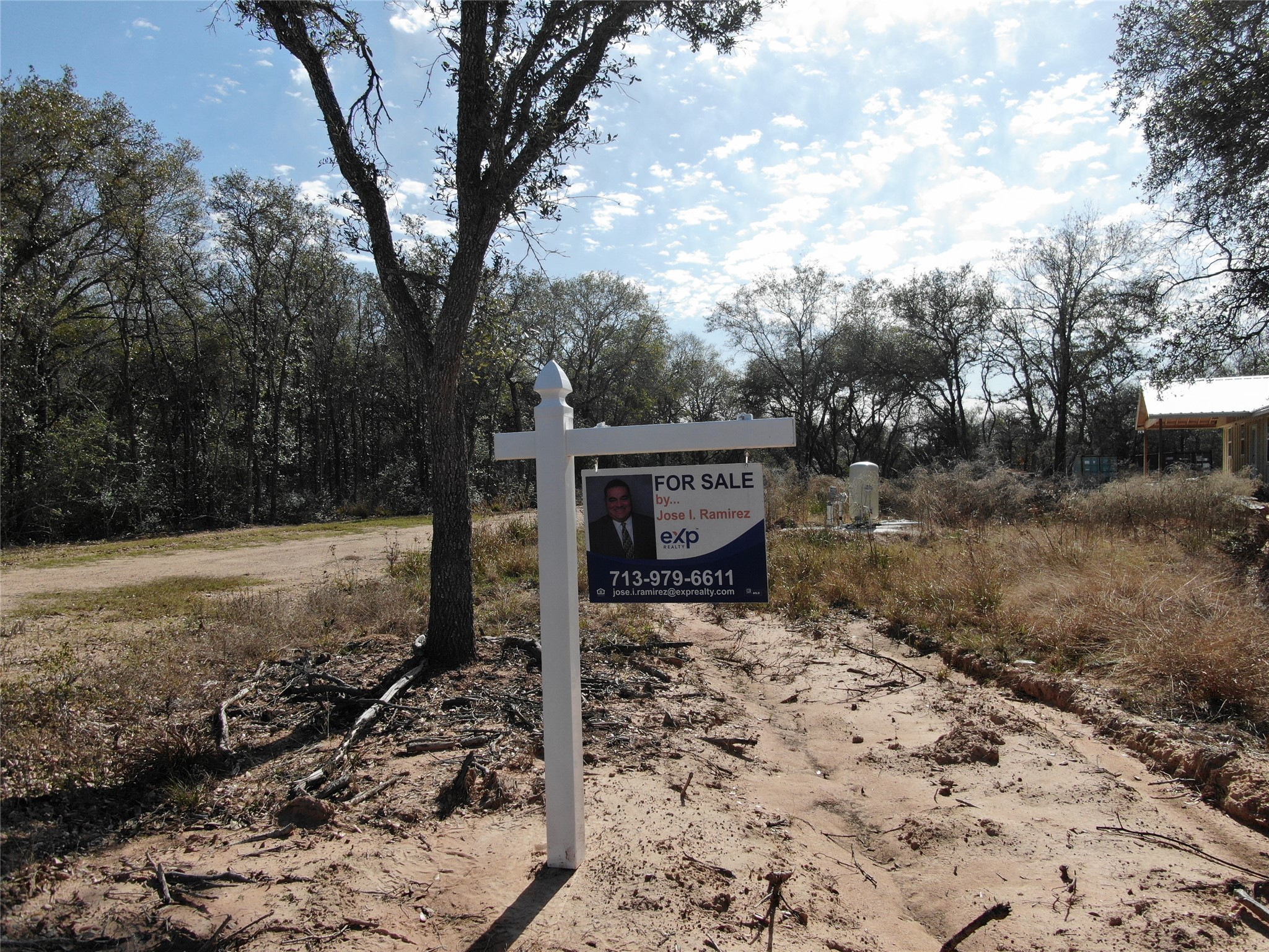 1044 Reeves Road Garwood, TX 77442 - Photo 3 of 18 a backyard of a house with lots of green space