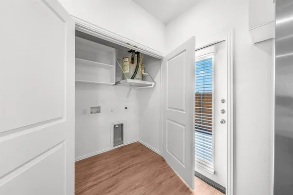 a view of a livingroom with wooden floor