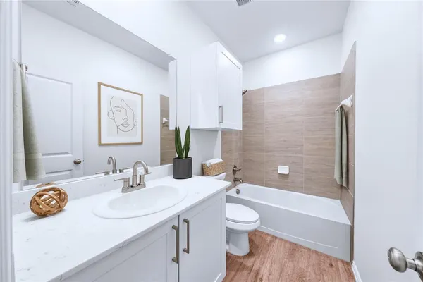 a view of a patio with couches chairs and a potted plant