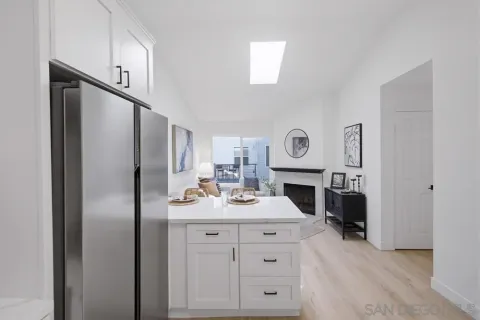 a kitchen with cabinets and stainless steel appliances