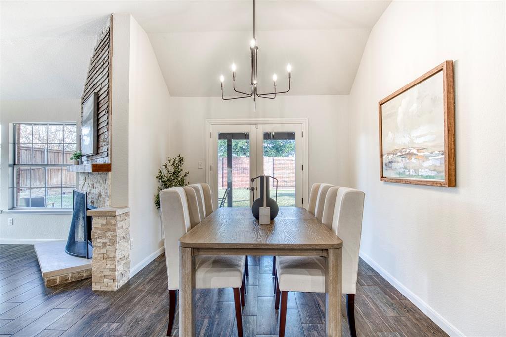 10814 Spring Lake Road Frisco, TX 75035 - Photo 12 of 40 a view of a dining room with furniture window and wooden floor