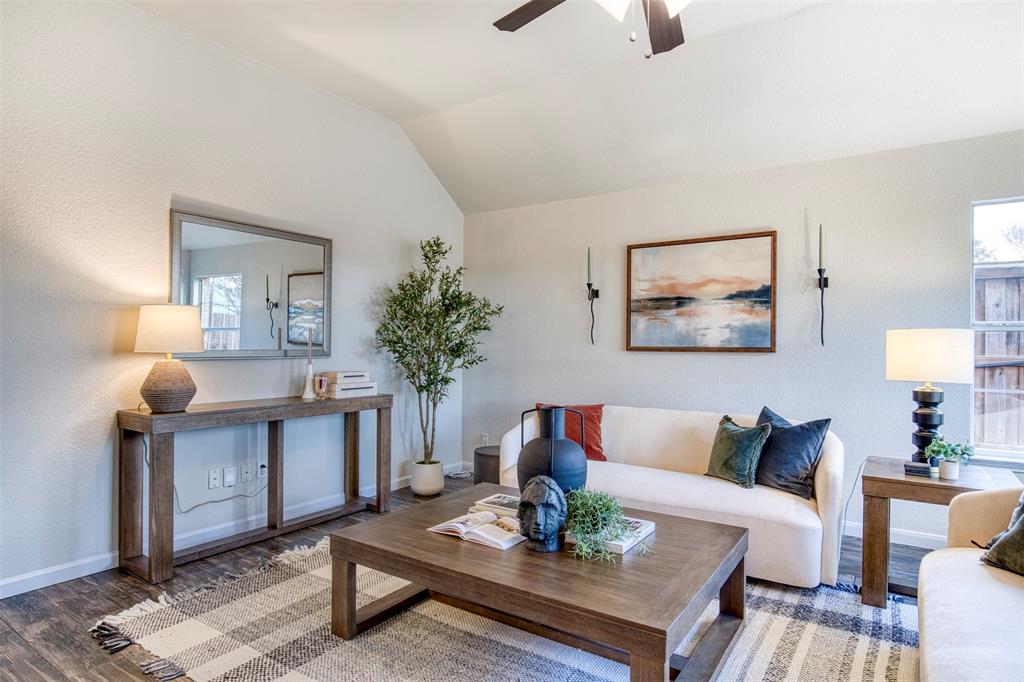 10814 Spring Lake Road Frisco, TX 75035 - Photo 14 of 40 a living room with furniture and wooden floor