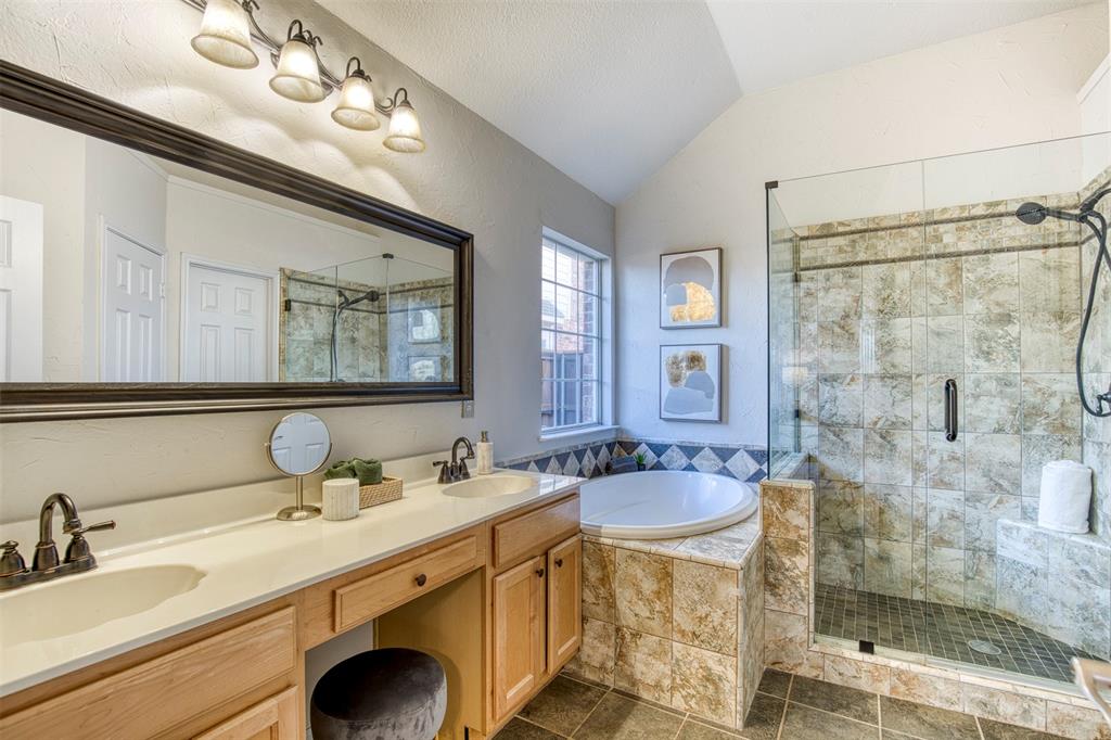10814 Spring Lake Road Frisco, TX 75035 - Photo 18 of 40 a bathroom with a sink double vanity and a mirror