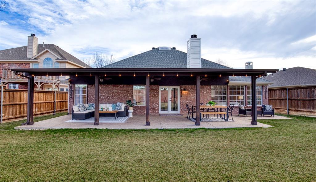 10814 Spring Lake Road Frisco, TX 75035 - Photo 39 of 40 a front view of a house with garden