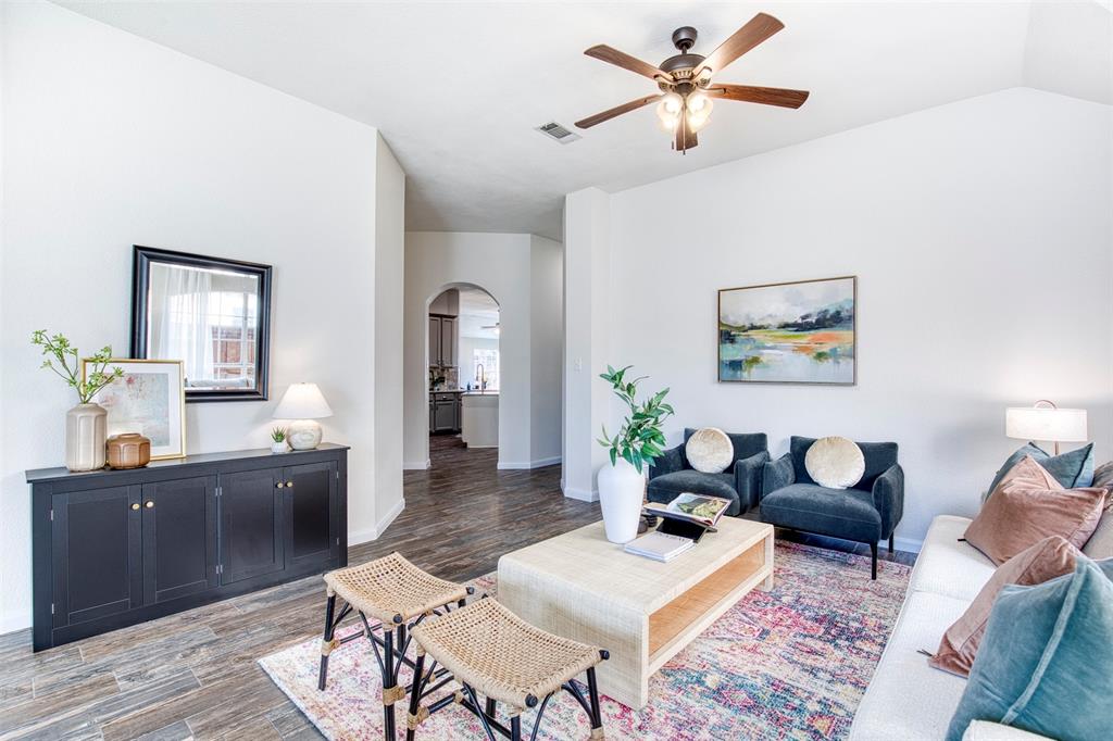 10814 Spring Lake Road Frisco, TX 75035 - Photo 6 of 40 a living room with furniture and wooden floor