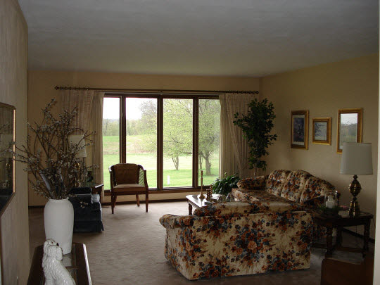 7823 East Rockton Road Roscoe, IL 61073 - Photo 5 of 6 a living room with furniture and large windows