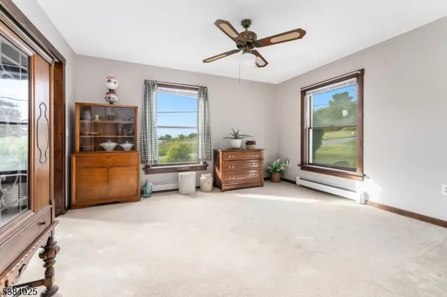 a view of a livingroom with furniture and a window