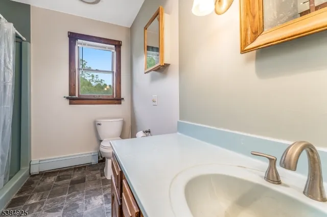 a bathroom with a sink and mirror