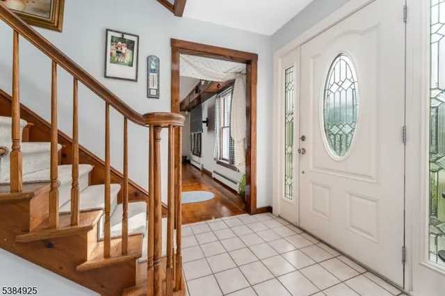 a view of an entryway with wooden floor