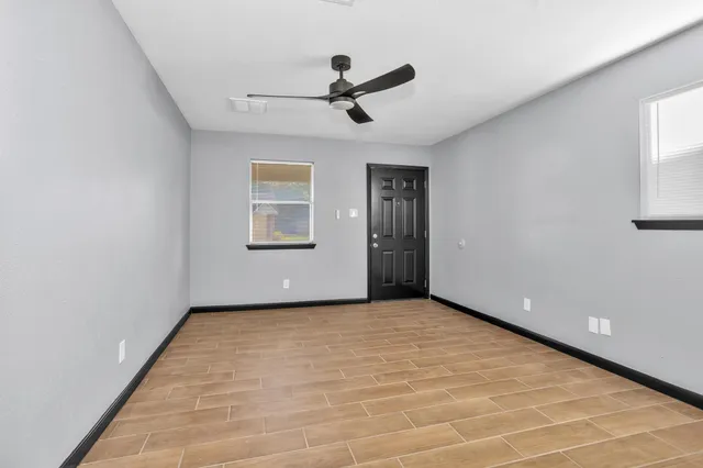 a view of an empty room with a window