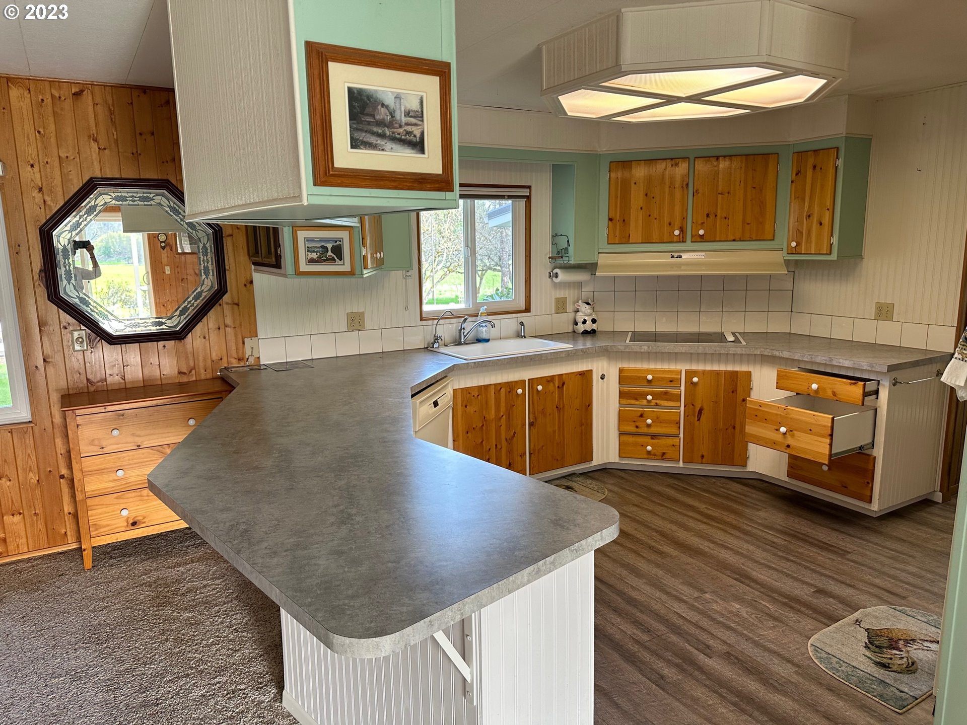 49660 Northwest Pongratz Road Banks, OR 97106 - Photo 5 of 22 a kitchen with stainless steel appliances granite countertop a granite counter tops and a wooden floor