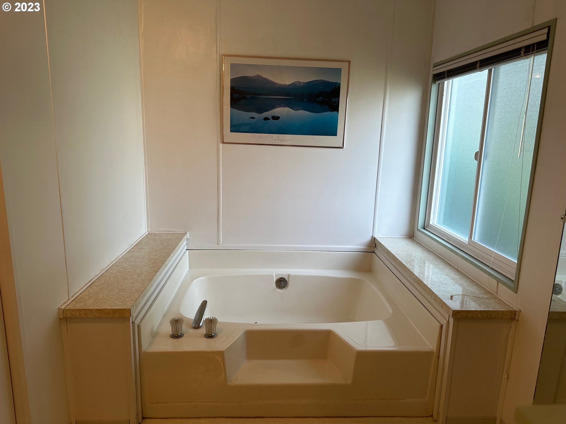 49660 Northwest Pongratz Road Banks, OR 97106 - Photo 7 of 22 a bathroom with a tub and a window
