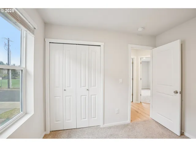 a view of a roof deck with table and chairs a barbeque with wooden floor