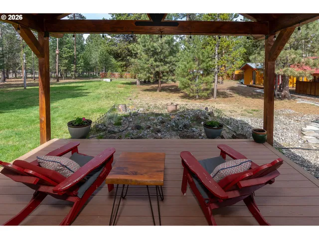 a view of a patio with wooden floor