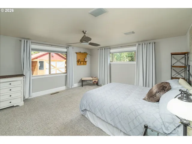 a bedroom with a bed and window