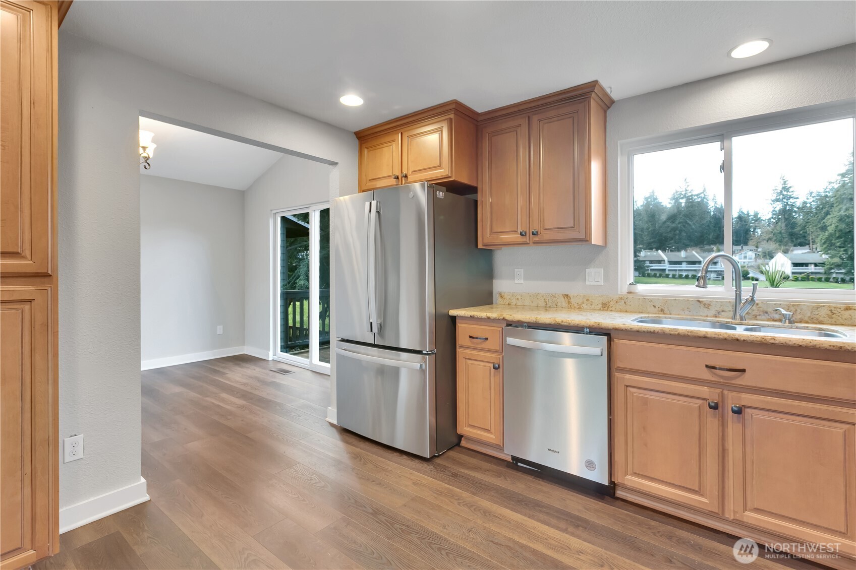 32417 29th Avenue Southwest Federal Way, WA 98023 - Photo 13 of 39 a kitchen with granite countertop a refrigerator and a sink