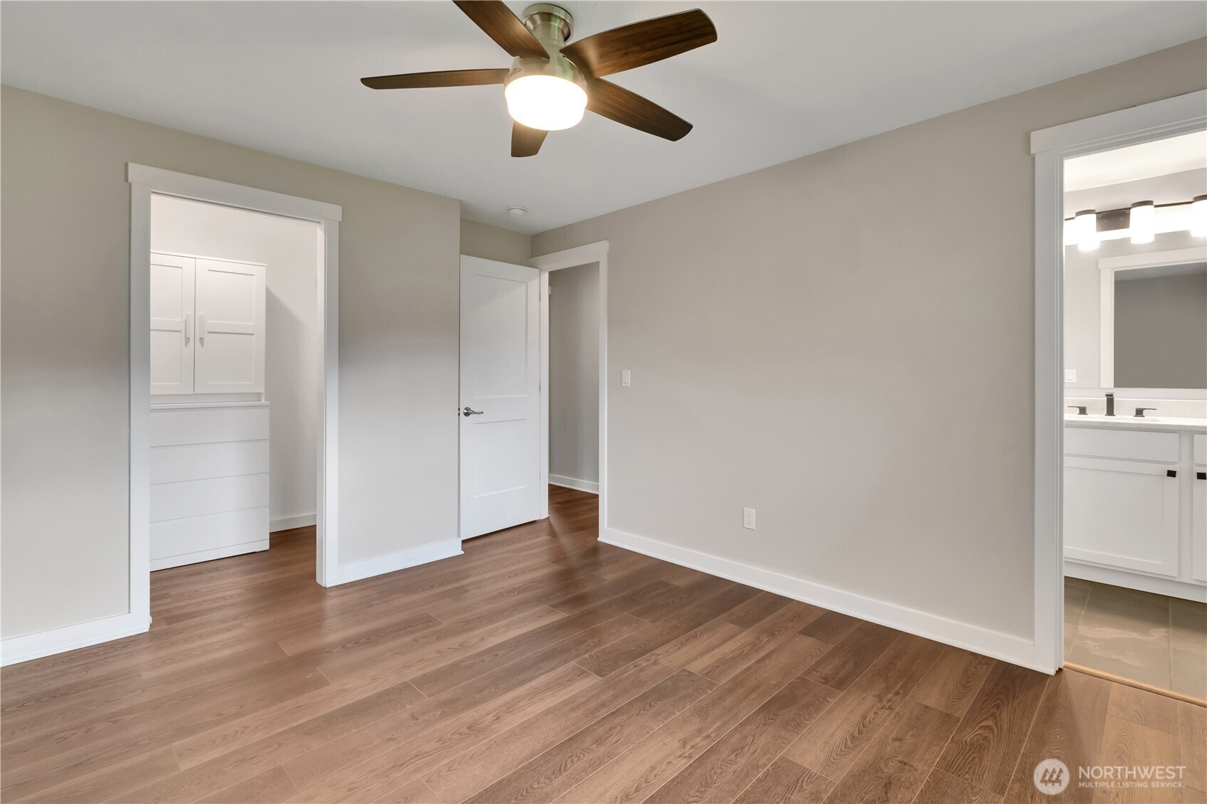 32417 29th Avenue Southwest Federal Way, WA 98023 - Photo 17 of 39 an empty room with wooden floor and a ceiling fan