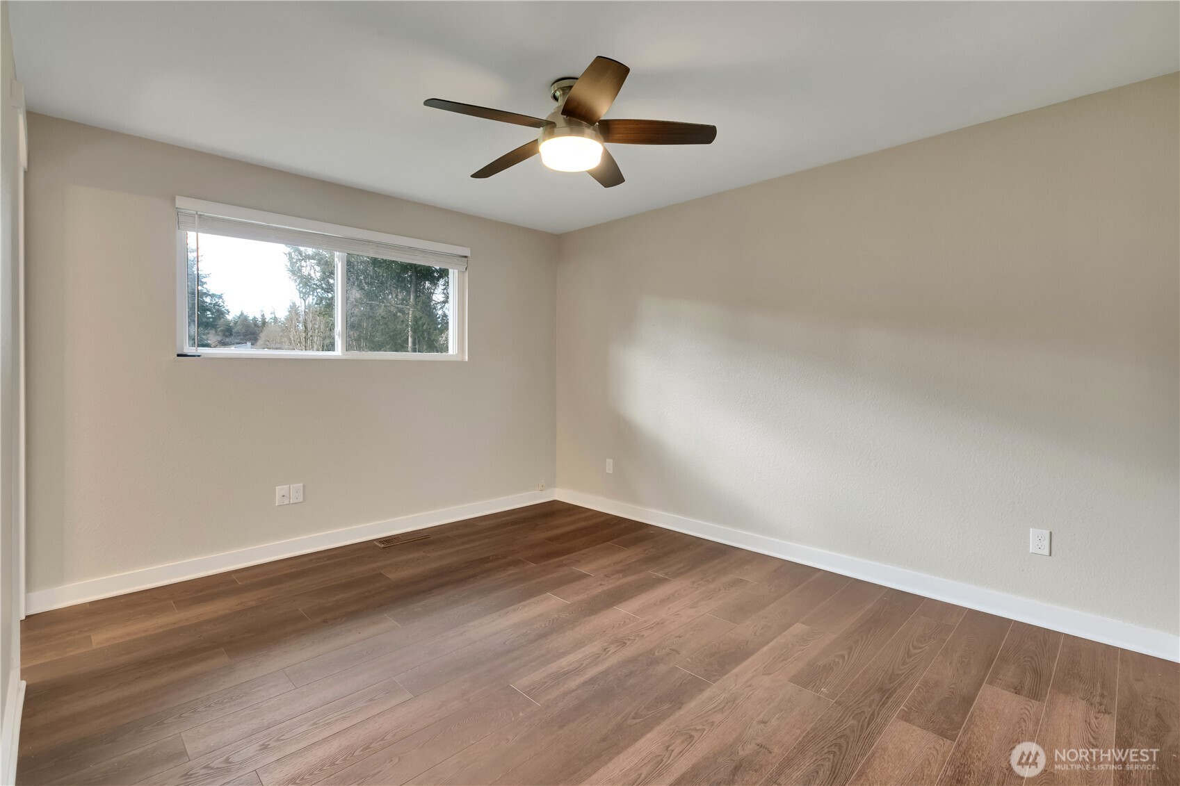 32417 29th Avenue Southwest Federal Way, WA 98023 - Photo 18 of 39 an empty room with wooden floor and windows