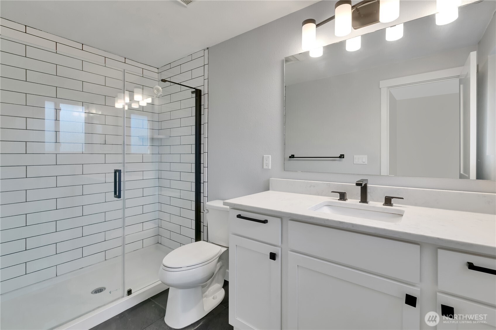 32417 29th Avenue Southwest Federal Way, WA 98023 - Photo 19 of 39 a bathroom with a sink a toilet and shower
