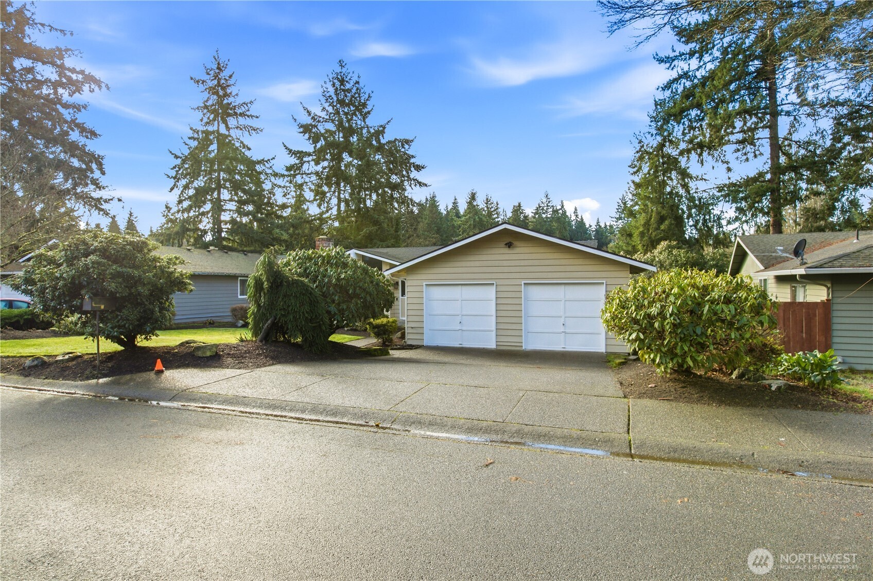 32417 29th Avenue Southwest Federal Way, WA 98023 - Photo 2 of 39 a front view of a house with a yard and garage