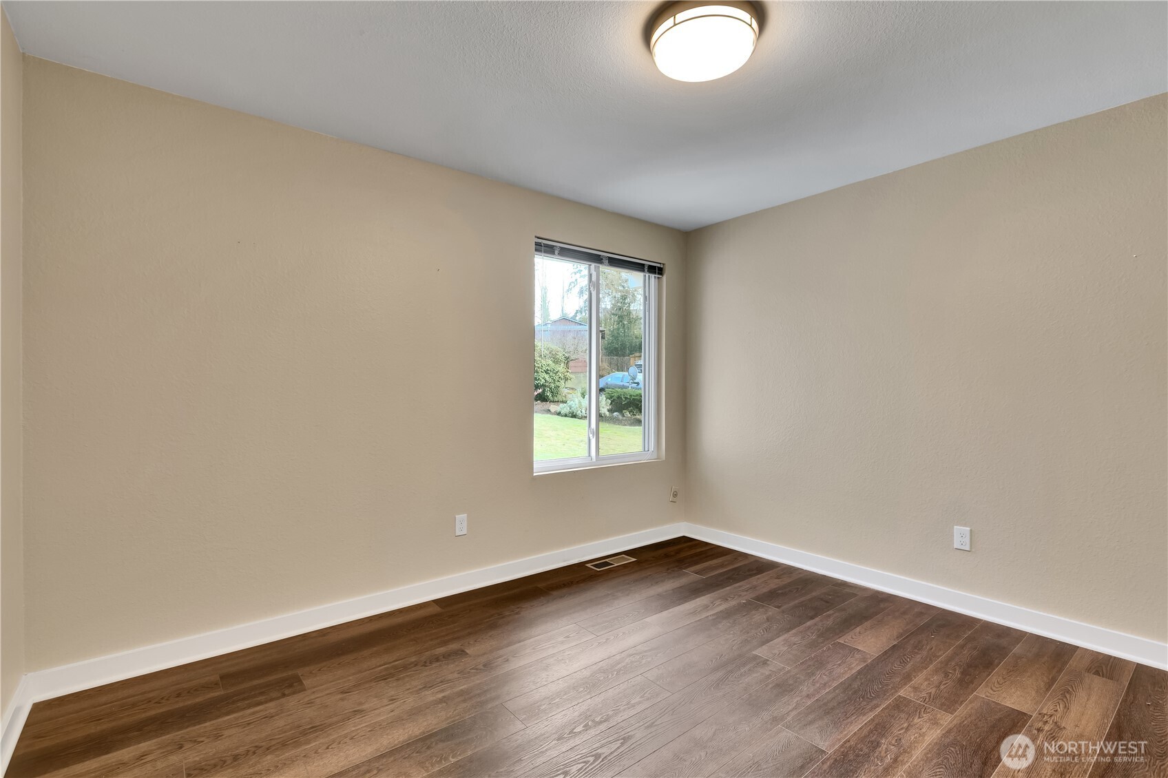 32417 29th Avenue Southwest Federal Way, WA 98023 - Photo 22 of 39 an empty room with wooden floor and windows