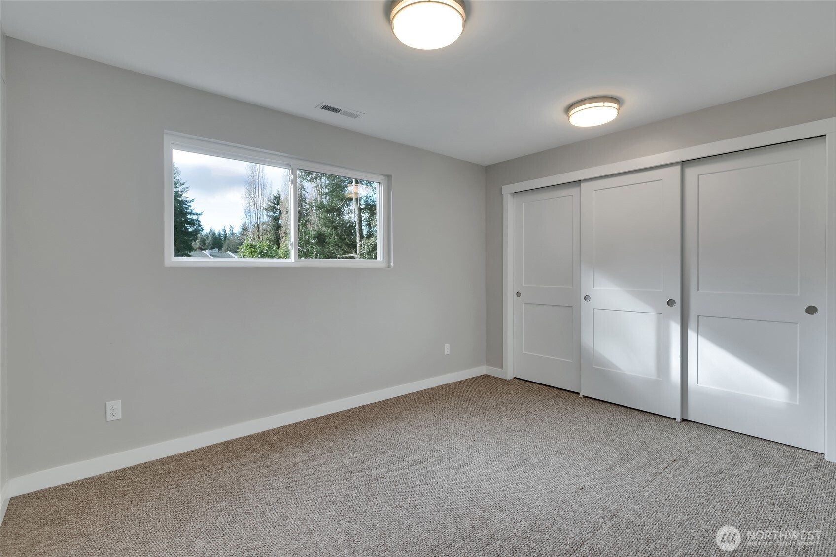 32417 29th Avenue Southwest Federal Way, WA 98023 - Photo 26 of 39 an empty room with windows and closet