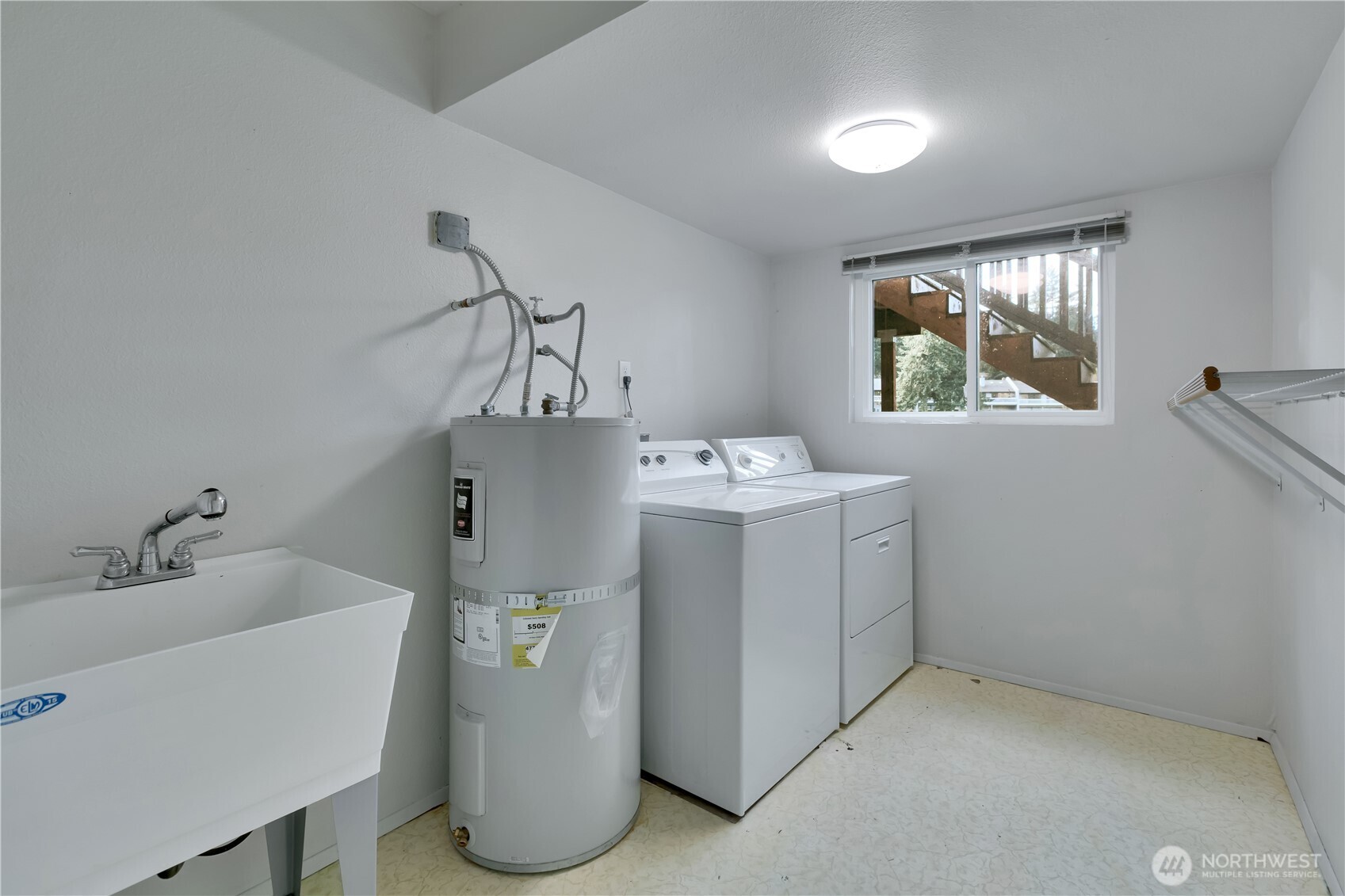32417 29th Avenue Southwest Federal Way, WA 98023 - Photo 31 of 39 a utility room with a window dryer and washer
