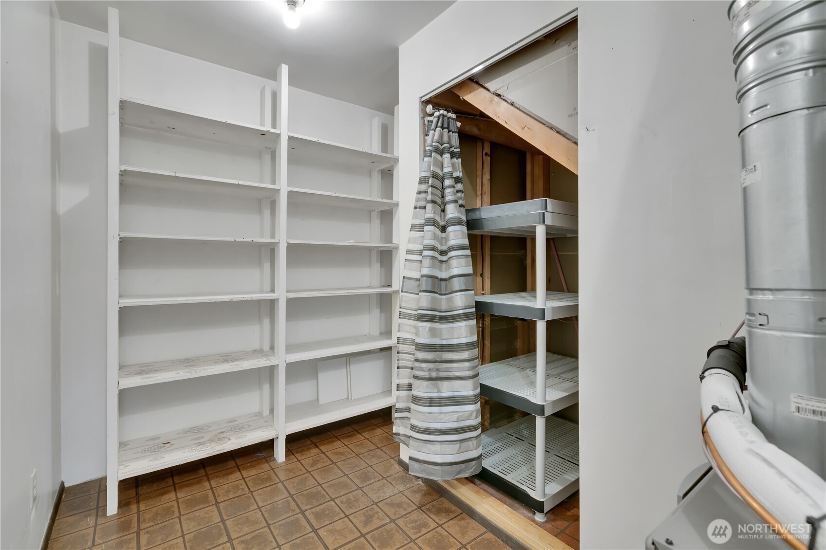 32417 29th Avenue Southwest Federal Way, WA 98023 - Photo 32 of 39 a room with chair and a cabinet