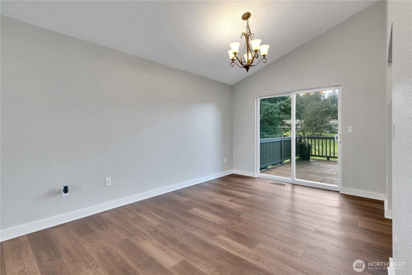 32417 29th Avenue Southwest Federal Way, WA 98023 - Photo 8 of 39 a view of an empty room with wooden floor and a window