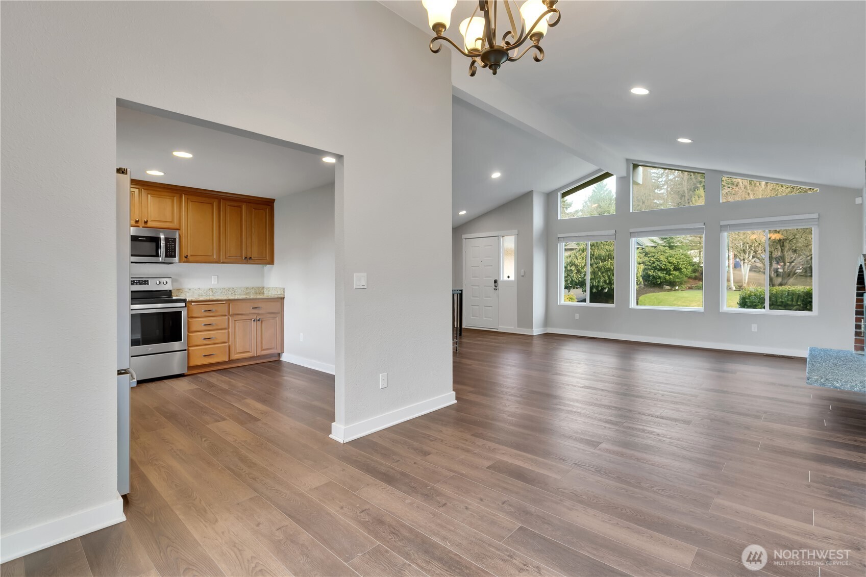 32417 29th Avenue Southwest Federal Way, WA 98023 - Photo 10 of 39 an empty room with wooden floor and windows