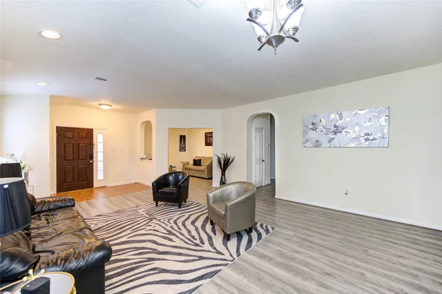 a living room with furniture and decor