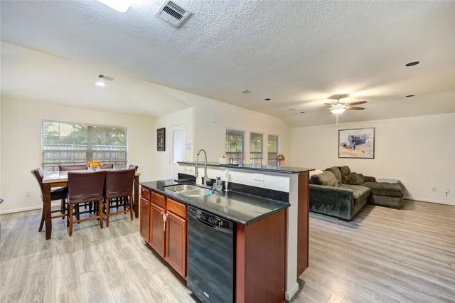 a white bath tub sitting next to a shower