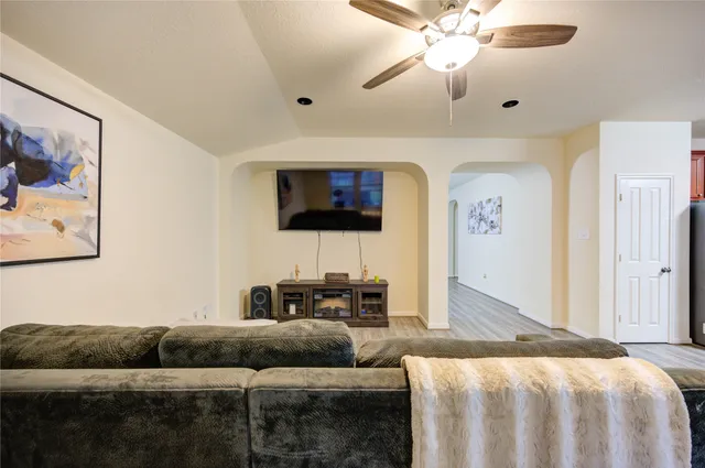 a view of a hallway with white doors