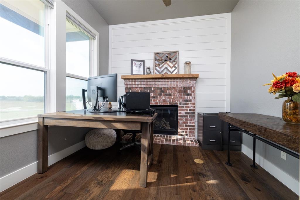 338 County Road 4223 Decatur, TX 76234 - Photo 19 of 37 One of two home offices located at the entry. This office features a gas fireplace. The 2nd office has a safe closet/tornado closet.