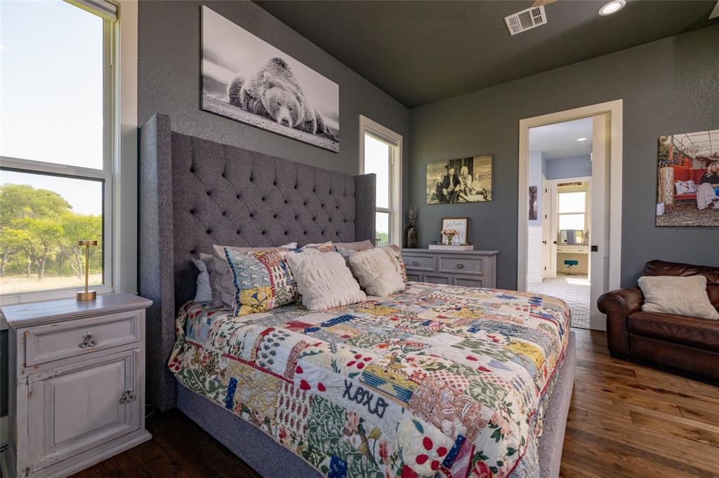 338 County Road 4223 Decatur, TX 76234 - Photo 21 of 37 Primary Bedroom view toward en suite bathroom and closets.